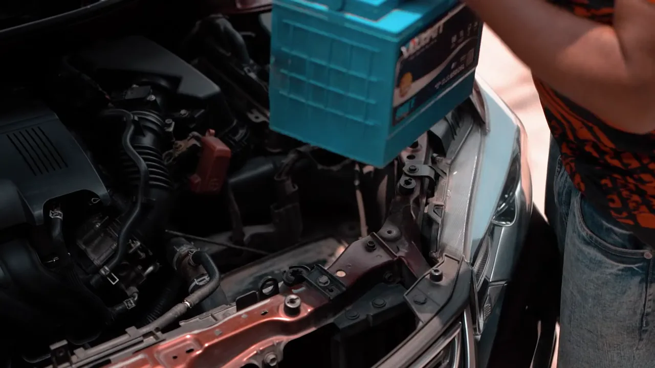 KSA Motors technician replacing a vehicle battery