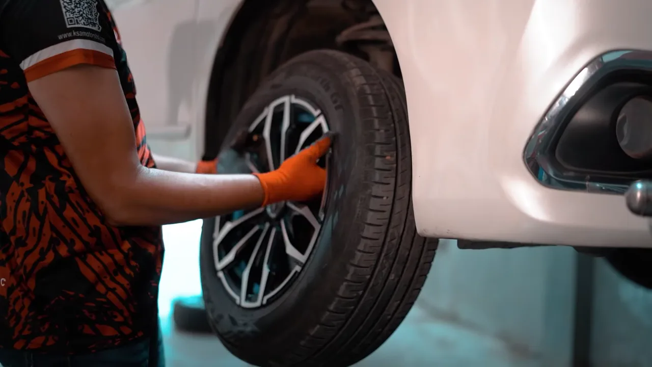 KSA Motors technician servicing a vehicle brake